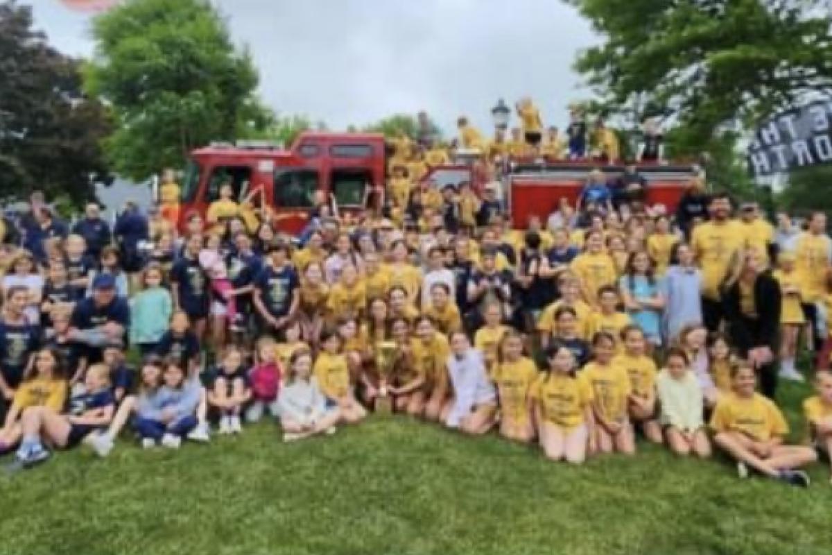 Group of participants in front of a Fire truck